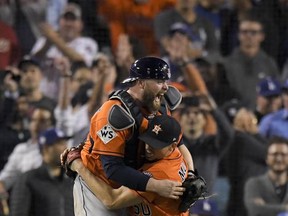 Houston Astros catcher Brian McCann and starting pitcher Charlie Morton celebrate after win against the Los Angeles Dodgers in Game 7 of baseball's World Series Wednesday, Nov. 1, 2017, in Los Angeles. (AP Photo/Mark J. Terrill)
