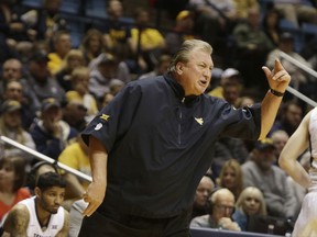 West Virginia head coach Bob Huggins yells to his players during the first half of an NCAA college basketball game against Long Beach State, Monday, Nov. 20, 2017, in Morgantown, W.Va. (AP Photo/Raymond Thompson)
