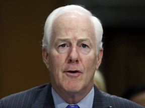 FILE - In this Sept. 19, 2017 file photo, Sen. John Cornyn, R-Texas, testifies during a hearing of the Senate Foreign Relations Committee on Capitol Hill in Washington. A bipartisan group of senators has introduced legislation designed to ensure federal and state governments accurately report relevant criminal history records to the FBI's database of prohibited gun buyers.  (AP Photo/Alex Brandon)