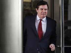 In this Nov. 6, 2017 photo, Paul Manafort, President Donald Trump's former campaign chairman, leaves the federal courthouse in Washington. Manafort and his deputy, Rick Gates, who were charged with violating federal money laundering, foreign lobbying and banking laws for behavior occurring as far back as 2012, have pleaded not guilty. (AP Photo/Jacquelyn Martin)