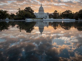 FILE - In this Oct. 10, 2017, file photo, the Capitol is seen at sunrise, in Washington. The crush of unfinished business facing lawmakers when they return to the Capitol this week would be daunting even if Washington were functioning at peak efficiency. (AP Photo/J. Scott Applewhite, File)