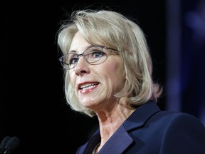 FILE - In this Oct. 13, 2017, file photo, Education Secretary Betsy DeVos speaks during a dinner hosted by the Washington Policy Center in Bellevue, Wash. The Education Department wants to narrow the scope of civil rights investigations at schools, focusing on individual complaints rather than systemic problems, according to a document obtained by The Associated Press. (AP Photo/Ted S. Warren, File)