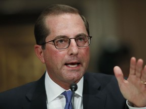 In this Nov. 29, 2017 photo, Alex Azar, President Donald Trump's nominee to become Secretary of Health and Human Services, testifies during a Senate Health, Education, Labor and Pensions Committee confirmation hearing on Capitol Hill in Washington. Azar,  nominated to take over the job of outgoing Health Secretary Tom Price, who resigned over his use of private jets, once defended a government official who spent public money on golf fees, steak dinners and Super Bowl tickets.  (AP Photo/Carolyn Kaster)