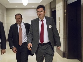 FILE - In this Nov. 2, 2017, file photo, Ike Kaveladze, right, who was among those at a June 2016 meeting at Trump Tower with President Donald Trump's son, leaves the Capitol after being interviewed by the House Intelligence Committee, on Capitol Hill in Washington. Two Russian-American's, lobbyist Rinat Akhmetshin and Kaveladze, met in June 2017 over coffee in Moscow where they discussed a meeting they had participated in a year before: a gathering at Trump Tower with President Donald Trump's son, his son-in-law and his then-campaign chairman. The Moscow meeting, which has not been previously disclosed, is now under scrutiny by investigators who want to know why the two men met in the first place and whether there was some effort to get their stories straight about the Trump Tower meeting just weeks before it would become public, The Associated Press has learned. (AP Photo/J. Scott Applewhite, File)