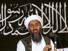 FILE - In this 1998 file photo made available on March 19, 2004, Osama bin Laden is seen at a news conference in Khost, Afghanistan. Never-before seen video of Osama bin Laden's son and potential successor was released Nov. 1, 2017, by the CIA in a trove of material recovered during the May 2011 raid that killed the al-Qaida leader at his compound in Pakistan. The video offers the first public look at Hamza bin Laden as an adult. Until now, the public has only seen childhood pictures of him. In recent years, al-Qaida has released audio messages from Hamza bin Laden. (AP Photo/Mazhar Ali Khan, File)