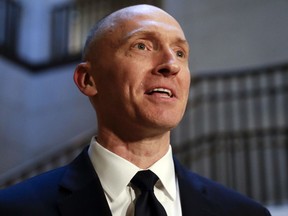 In this Nov. 2, 2017, photo, Carter Page, a foreign policy adviser to Donald Trump's 2016 presidential campaign, speaks with reporters following a day of questions from the House Intelligence Committee, on Capitol Hill in Washington. (AP Photo/J. Scott Applewhite)