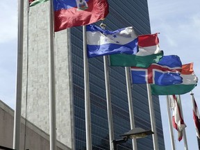 FILE - In this June 1, 2016, file photo, flags of some of the 193 countries fly in the breeze in front of the Secretariat building of the United Nations. State Department officials say the U.S. this week plans to vote against a yearly U.N. resolution that condemns the glorification of Nazism. That's because, as in past years, free speech protections and other problems make the resolution impossible for America to support. But officials don't want their opposition interpreted as tacit support for Nazism in this first rendition of the annual vote since President Donald Trump entered office. (AP Photo/Richard Drew, File)