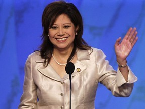 FILE - In this Aug. 27, 2008 file photo, then-Rep. Hilda Solis, D-Calif., waves as she speaks at the Democratic National Convention in Denver. One current and three former female members of Congress tell The Associated Press they have been sexually harassed or subjected to hostile sexual comments by their male colleagues while serving in the House. Solis, now a Los Angeles County supervisor, recalls repeated unwanted harassing overtures from one lawmaker, though she declined to name him or go into detail. (AP Photo/Ron Edmonds, File)