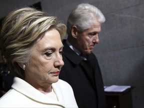 FILE - In this Jan. 20, 2017, file photo, former Sen. Hillary Clinton and former President Bill Clinton arrive on the West Front of the U.S. Capitol on Friday, Jan. 20, 2017, in Washington, for the inauguration ceremony of Donald J. Trump as the 45th president of the United States. Time has not healed the Democratic party's wounds. On Election Day 2016, Democrats suffered a devastating and shocking loss. A year later, they're still sorting through the wreckage. The infighting, the divisive personalities and the questions about how it happened are still front and center, threatening to hold the party back in elections on Tuesday and into next year's midterms. (Win McNamee/Pool Photo via AP, File)