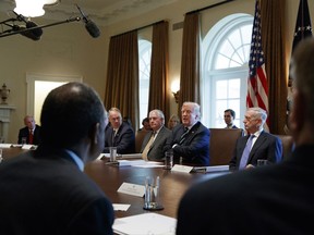 FILE - In this Oct. 16, 2017, file photo President Donald Trump speaks during a cabinet meeting at the White House in Washington, with from left, Director of National Intelligence Dan Coats, Interior Secretary Ryan Zinke, Secretary of State Rex Tillerson, and Defense Secretary Jim Mattis. The White House has already begun work on one of Trump's next priorities: welfare reform. He said changes were "desperately needed in our country" and that his administration would soon offer plans. In October, Trump said at a Cabinet meeting that welfare reform was "becoming a very, very big subject, and people are taking advantage of the system." (AP Photo/Evan Vucci)