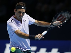 Roger Federer of Switzerland plays a return to Marin Cilic of Croatia during their mens singles match at the ATP World Finals at the O2 Arena in London, Thursday, Nov. 16, 2017. (AP Photo/Alastair Grant)