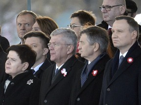 European Union President Donald Tusk, back row left, attends the official ceremony marking Poland's Independence Day, in Warsaw, Poland, Saturday, Nov. 11, 2017. In the first row from left are, Polish Prime Minister Beata Szydlo, Senate Speaker Stanislaw Karczewski, Parliament Speaker Marek Kuchcinski and President Andrzej Duda. Tusk joined celebrations in his native Poland on Independence Day, which celebrates the nation regaining its sovereignty at the end of World War I after being wiped off the map for more than a century.  (AP Photo/Alik Keplicz)