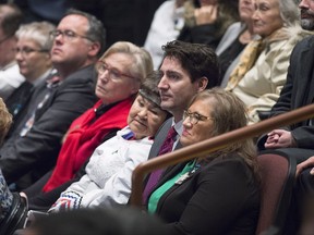 Prime Minister Justin Trudeau sits in the crowd before he delivered an apology on behalf of the Government of Canada to former students of the Newfoundland and Labrador Residential Schools in Happy Valley-Goose Bay, N.L. on Friday, Nov. 24, 2017. THE CANADIAN PRESS/Andrew Vaughan