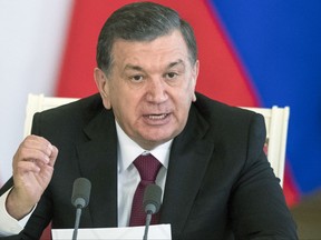 FILE - In this file photo taken on Wednesday, April 5, 2017, Uzbek President Shavkat Mirziyoyev speaks during a news conference during a visit to the Kremlin in Moscow, Russia. President Mirziyoyev said in a statement published by the Uzbekistan Foreign Ministry on Wednesday that his county is "prepared to use all of our means to offer assistance in investigating this terrorist attack." He also offered condolences to families of the victims. (AP Photo/Pavel Golovkin, file)