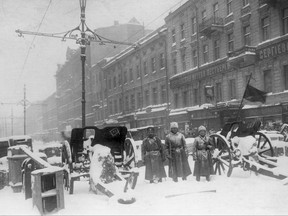 In this photo taken in Feb. 1917, provided by Russian State Archive of Social and Political History, soldiers stand at the barricade in Liteyny Avenue in St.Petersburg, Russia. The 1917 Bolshevik Revolution was long before the digital revolution allowed anyone to instantly document events. But the clumsy cameras of the time still caught some images that capture the period's drama. (Yakov Steinberg, Russian State Archive of Social and Political History via AP)