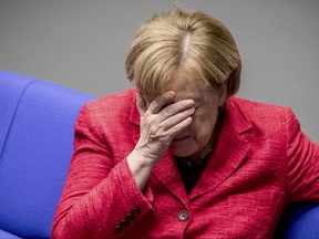 German Chancellor Angela Merkel attends a plenary session of German parliament Bundestag in Berlin, Tuesday, Nov. 21, 2017. (Michael Kappeler/dpa via AP)
