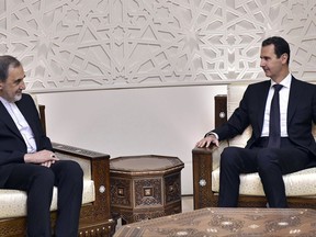 Syrian President Bashar Assad, right, meets with Ali Akbar Velayati, an adviser to Iran's Supreme Leader Ayatollah Ali Khamenei, in Damascus, Syria, Tuesday, Nov 7, 2017.