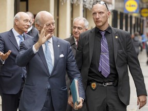 FILE - This Tuesday, Nov. 28, 2017 file photo, UN Special Envoy of the Secretary General for Syria, Staffan de Mistura, 2nd left, and Deputy UN Special Envoy for Syria Ramzy Ezzeldin Ramzy, left, arrive for a meeting with Head of the Syrian Negotiation Commission, SNC, during the Intra Syria talks, in Geneva, Switzerland. Much has changed since Syria's warring sides held the last round of UN-brokered talks in Geneva in the summer: The U.N. is sidestepping the divisive question of President Bashar Assad's future, the Islamic State group has been defeated in all its strongholds, and Russia, Iran, Turkey and the U.S. have engaged in high level diplomacy that has largely frozen the lines of conflict. (Salvatore Di Nolfi/Keystone via AP, File)