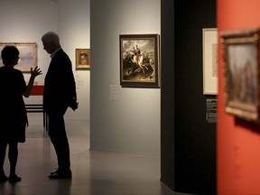 Museum employees walking through the exhibition 'Gurlitt : Status Report'  in Bonn, Germany, Thursday, Nov. 2, 2017. Bundeskunsthalle museum is presenting some 250 art works from the 1,500-piece collection hoarded for decades by the late collector Cornelius Gurlitt, including pieces likely looted from Jewish owners under Nazi rule.  (Oliver Berg/dpa via AP)
