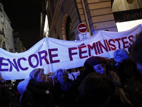 Activists hold a banner reading: Still feminists duringa a protest in Paris, Tuesday, Nov. 14, 2017. Justice Minister Nicole Belloubet provoked consternation and dismay among feminist groups by saying a legal minimum age of 13 for sexual consent "is worth considering." (AP Photo/Christophe Ena)