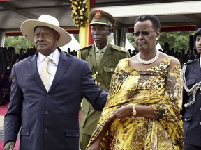 FILE -- In this Thursday, May 12, 2016, file photo, Uganda's longtime president Yoweri Museveni and his wife Janet, right, attend his inauguration ceremony in the capital Kampala, Uganda. After the stunning fall of Zimbabwe's Robert Mugabe, attention has turned to other longtime African leaders accused of trying to extend their rule. (AP Photo/Stephen Wandera, File)