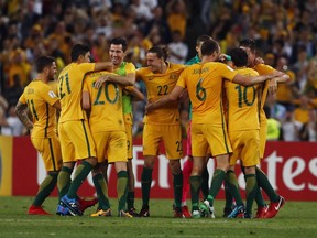 Australian players celebrate after defeating Honduras during their World Cup soccer playoff deciding match in Sydney, Australia, Wednesday, Nov. 15, 2017. (AP Photo/Daniel Munoz)