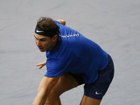 Rafael Nadal of Spain returns the ball to Pablo Cuevas of Uruguay during the third round of the Paris Masters tennis tournament at the Bercy Arena in Paris, France, Thursday, Nov. 2, 2017. (AP Photo/Francois Mori)