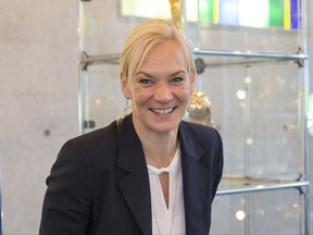 In this Nov. 16, 2017 photo, Bibiana Steinhaus, the first female referee to officiate in the soccer Bundesliga, smiles during an interview with The Associated Press at the German soccer federation's headquarters in Frankfurt, Germany. (AP Photo/Ciaran Fahey)