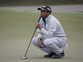 S.S.P. Chawrasia of India lines up a putt on the 13th hole at the Hong Kong Open golf tournament in Hong Kong, Saturday, Nov. 25, 2017. (AP Photo/Kin Cheung)