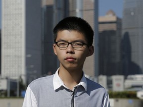 Young Hong Kong democracy activist Joshua Wong listens to questions during an interview outside the legislative council in Hong Kong, Wednesday, Nov. 1, 2017. The 21-year-old Wong, who is currently appealing a prison sentence related to pro-democracy protests, warns that China's rise means human rights are in increasingly greater danger of being overshadowed globally by business interests. (AP Photo/Kin Cheung)