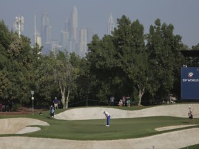 Tommy Fleetwood of England plays a shot on the third hole during the second round of the DP World Tour Championship golf tournament in Dubai, United Arab Emirates, Friday, Nov. 17, 2017. (AP Photo/Kamran Jebreili)