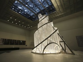 In this Monday, Nov. 6, 2017, photo, "Fountain of Light" by Ai Weiwei is seen at the Louvre Abu Dhabi, United Arab Emirates. The Louvre Abu Dhabi is preparing its grand opening _ unveiling its treasures to the world after a decade-long wait and questions over laborers' rights. The museum, which opens on Saturday to the public, encompasses work from both the East and West. (AP Photo/Kamran Jebreili)