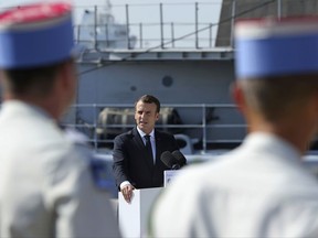 French President Emmanuel Macron addresses French military personnel at a naval base during the second day of his visit to Abu Dhabi, United Arab Emirates, Thursday, Nov. 9, 2017. (AP Photo/Kamran Jebreili)