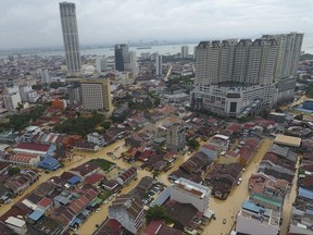 An aerial view shows a flooded George Town city in Penang, Malaysia, Sunday, Nov. 5, 2017. A northern Malaysian state has been paralyzed by a severe storm that led to two deaths and some 2,000 people evacuated in the worst flooding in years, officials say. (AP Photo)