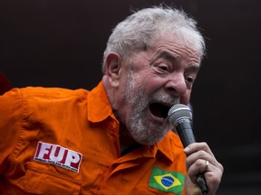FILE - In this Tuesday, Oct. 3, file 2017 photo, Brazil's former President Luiz Inacio Lula da Silva speaks at a protest against the government's plan to increase privatizations, including in the oil industry, in front of the state-run oil company Petrobras headquarters in Rio de Janeiro, Brazil. Half of Brazilians want da Silva to win the coming 2018 election and return to the office he occupied between 2003 and 2010. The other half wants him in prison. (AP Photo/Bruna Prado, File)