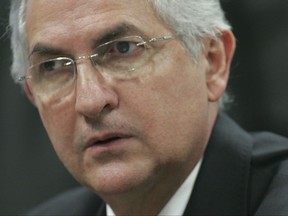 FILE - In this Oct. 27, 2009 file photo, Caracas' Mayor Antonio Ledezma attends a Senate meeting, in Brasilia, Brazil. The former mayor has escaped house arrest in Caracas and arrived in Colombia, Friday, Nov. 17, 2017. (AP Photo/Eraldo Peres, File)