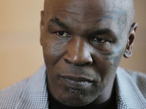 FILE - In this May 4, 2017 file photo, Mike Tyson gives an interview to The Associated Press, in Dubai, United Arab Emirates. Chilean authorities said Thursday, Nov. 9, 2017, that the former heavyweight champion has been denied entry to the country and is being sent back to the U.S. (AP Photo/Kamran Jebreili, File)