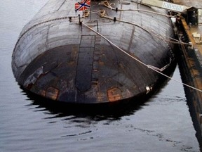 FILE - This May 2000 file photo shows the Russian nuclear submarine Kursk at a navy base in Vidyayevo, Russia. The Kursk suffered two powerful explosions and sank during naval maneuvers in the Barents Sea on Aug, 12, 2000. Most of the 118 crew members were killed instantly, but 23 men were able to flee to a rear compartment where they waited for help. After Russian submersibles failed to open the escape hatch for a week, Norwegian divers opened the hatch within hours, but all 23 men had suffocated. The accident was blamed on leaking torpedo fuel. (AP Photo/File)