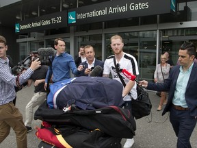 New Zealand-born England cricket star Ben Stokes is surrounded by media as he arrives in Christchurch, New Zealand, Wednesday, Nov. 29, 2017. Stokes is in New Zealand to visit family and possibly play for Canterbury province during his stay. (AP Photo/Mark Baker)