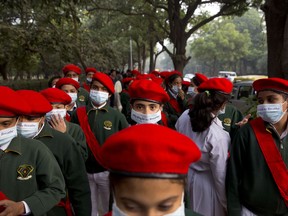 School children take out a march to express their distress on the alarming levels of pollution in the city, in New Delhi, India, Wednesday, Nov. 15, 2017. Thick smog has constricted India's capital this week, smudging landmarks from view and leaving residents frustrated at the lack of meaningful action by authorities. The air was the worst it has been all year in New Delhi, with microscopic particles that can affect breathing and health spiking to 75 times the level considered safe by the World Health Organization. (AP Photo/Manish Swarup)