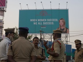 An Indian Police officer briefs his colleagues at the entrance of HITECH city, venue of the Global Entrepreneurship Summit in Hyderabad, India, Monday, Nov. 27, 2017. The event -- co-hosted by the United States and India -- runs from Nov. 28-30 and will be attended by U.S. presidential adviser and daughter Ivanka Trump and Indian Prime Minister Narendra Modi.(AP Photo/Mahesh Kumar A.)