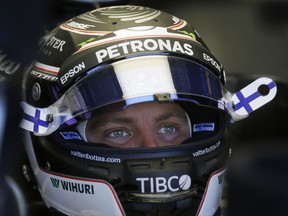 Mercedes driver Valtteri Bottas, of Finland, sits inside his car during the first free practice at the Interlagos race track in Sao Paulo, Brazil, Friday, Nov. 10, 2017. (AP Photo/Nelson Antoine)