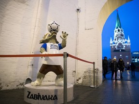The mascot of the 2018 World Cup, the wolf named Zabivaka, is placed at the entrance of Kutafya Tower in Kremlin, Moscow, Russia, Thursday, Nov. 30, 2017. The Final Draw for the 2018 Fifa World Cup in Russia will take place on December 1 in the concert hall of the State Kremlin Palace in Moscow. (AP Photo/Pavel Golovkin)