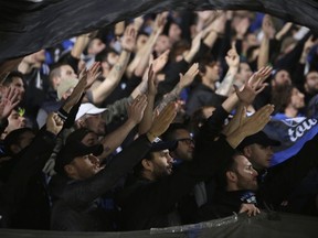 Atalanta fans shout slogans prior to the start of the Europa League group E soccer match between Apollon Limassol and Atalanta at the GSP stadium, in Nicosia, Cyprus, on Thursday, Nov. 2, 2017. (AP Photo/Petros Karadjias)