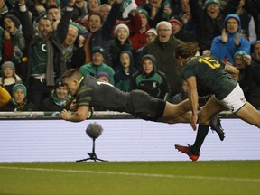 Ireland's Andrew Conway, left, scores a try against South Africa during a rugby union international match at the Aviva stadium in Dublin, Ireland, Saturday, Nov. 11, 2017. (AP Photo/Peter Morrison)