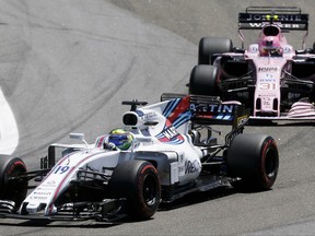 Williams driver Felipe Massa, of Brazil, steers his car ahead of Force India driver Esteban Ocon, of France, on the first lap of the Brazilian Formula One Grand Prix at the Interlagos race track in Sao Paulo, Brazil, Sunday, Nov. 12, 2017. (AP Photo/Nelson Antoine)