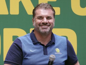 FILE  - In this Nov. 16, 2017, file photo Australian soccer team head coach Ange Postecoglou smiles during a reception following their qualification to the 2018 soccer World Cup in Sydney, Australia. Postecoglou has quit as Australia coach a week after the Socceroos secured a spot at next year's World Cup with an intercontinental win over Honduras. (AP Photo/Rick Rycroft, File)