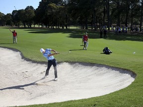 Jordan Spieth of the U.S. hits a shot from fairway bunker on the 17th during the second round of the Australian Open Golf tournament in Sydney, Friday, Nov. 24, 2017. (AP Photo/Rick Rycroft)