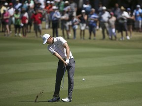 Jordan Spieth of the U.S. hits a shot from the 1rst fairway during the third round of the Australian Open Golf tournament in Sydney, Saturday, Nov. 25, 2017. (AP Photo/Rick Rycroft)