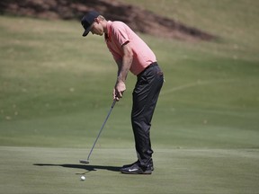 Australia's Cameron Davis putts on the 5th green during the third round of the Australian Open Golf tournament in Sydney, Saturday, Nov. 25, 2017. (AP Photo/Rick Rycroft)